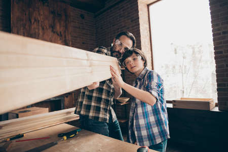Portrait of cute charming concentrated family hobby occupation look plane home workstation glasses look home beard checkered shirt glasses goggles protectiveの写真素材