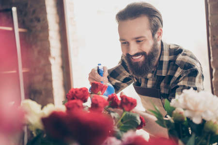 Close up photo of charming attractive millennial freelancer hold hand feel positive cheerful satisfied enjoy dressed plaid shirt greenhouseの写真素材