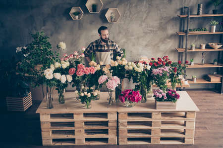 Above high angle view of his he nice attractive content successful guy hobby lover among beautiful peony bunch retail gardening service at industrial loft concrete style salon indoorsの写真素材