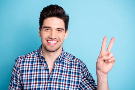 Portrait of cute pretty classy man youngster isolated have free time rest rejoice relax make v-signs...