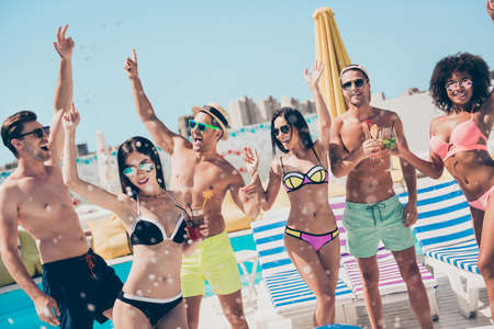 Nice attractive slim fit thin sporty cheerful cheery carefree guys group at fashionable spa hotel club having fun best buddy fellow event meeting gathering hang outの写真素材