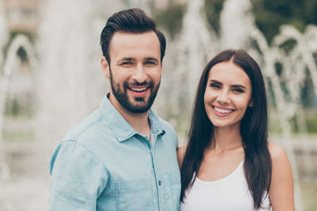 Close up photo of cute charming lovely millennial person feel satisfied content cheerful have free time outside town handsome shirt singlet top beardedの写真素材