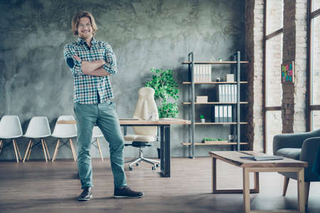 Full body photo of charming man crossing his hands looking wearing eyeglasses eyewear checkered plaid shirt trousers standing in industrialの写真素材