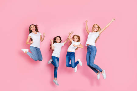 Full length body size view of four nice attractive adorable slim fit cheerful glad overjoyed excited long hair girls having fun rejoicing funky mood attainment motherhood isolated on pink backgroundの写真素材