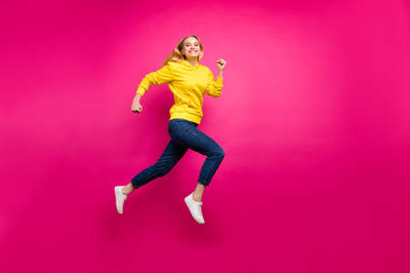 Full length photo of crazy lady jumping high running shopping wear casual outfit isolated pink...