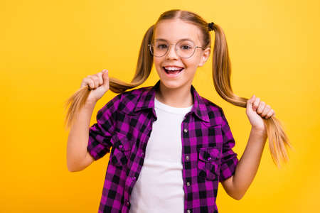 Closeup photo of little lady play with tails weekend free time wear specs checkered shirt isolated...