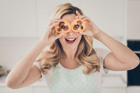 Close-up portrait of her she nice attractive lovely cheerful wavy-haired lady having fun with orange...