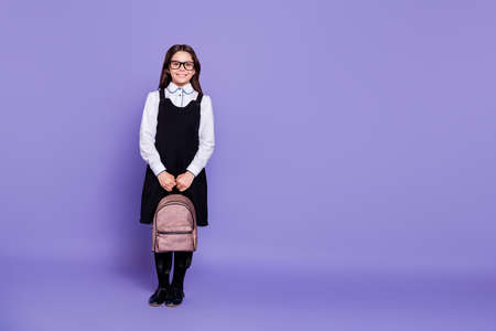 Full length body size view of nice attractive cheerful content intelligent wavy-haired pre-teen girl ready to class work carrying bag isolated, over bright vivid shine violet backgroundの写真素材