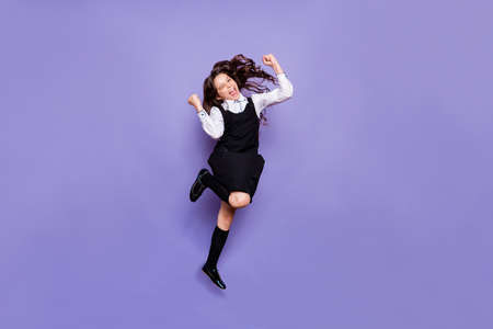 Full length body size view of nice attractive cheerful cheery glad crazy wavy-haired pre-teen girl...
