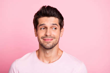 Closeup photo of amazing guy look silly empty space wearing casual outfit isolated on pink backgroundの写真素材