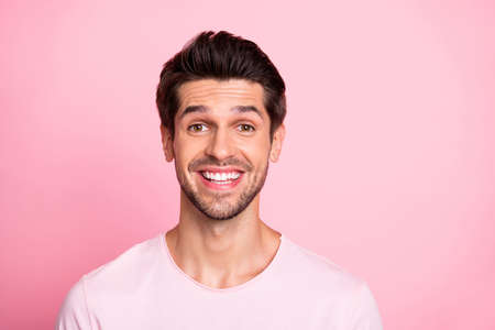 Closeup photo of amazing overjoyed macho wearing casual outfit isolated on pink backgroundの写真素材