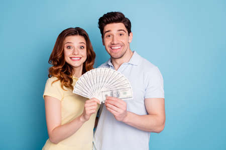 Portrait of his he her she nice attractive cheerful cheery funny people holding in hands hundreds...