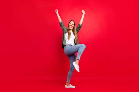 Full length bosy size photo of fortunate attractive nice cute glad girl hanging out in club while isolated with red backgroundの写真素材