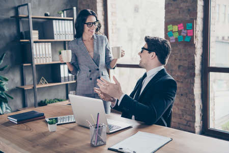 Photo of two freelancer coworkers having been granted to work for international major corporation being performed at general managers levelの写真素材