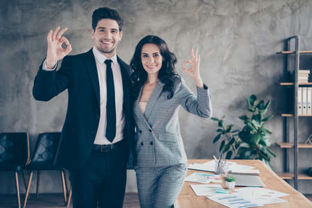 Photo of two directors of different companies having signed contract about coworking and friendship between themの写真素材