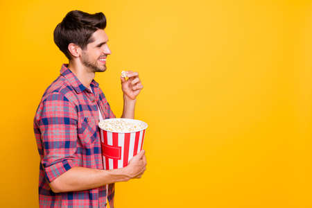 Photo of rejoicing enjoying cheerful man watching her relatives fight for last piece of meat while isolated with vivid backgroundの写真素材