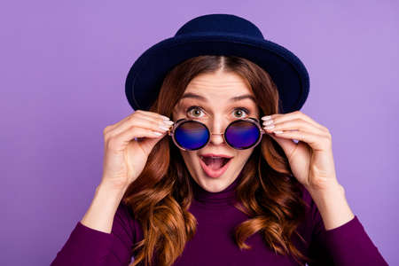 Close up photo of impressed cute youngster look stare scream shout isolated over purple violet backgroundの写真素材