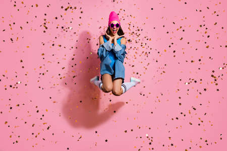 Full length photo of cheerful youth in eyewear eyeglasses screaming wow omg wearing blue swimsuit body suit isolated over pink backgroundの写真素材