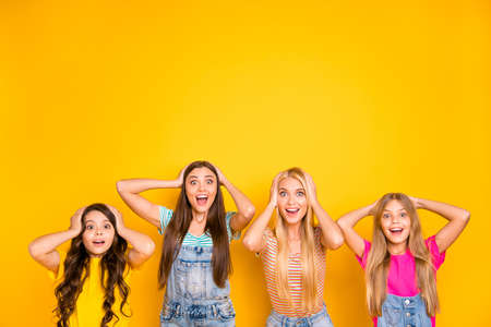 Close up photo of four nice lovely funny funky emotional cool hipsters moms mommy mama looking at camera isolated vibrant background with copy spaceの写真素材