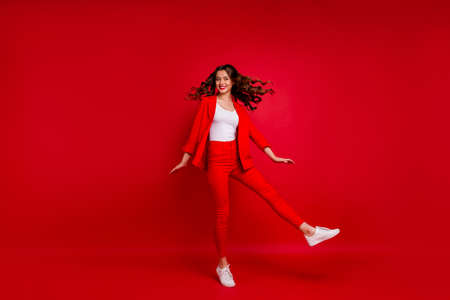 Full size photo of stunning lady turning around having lips stick isolated over red background