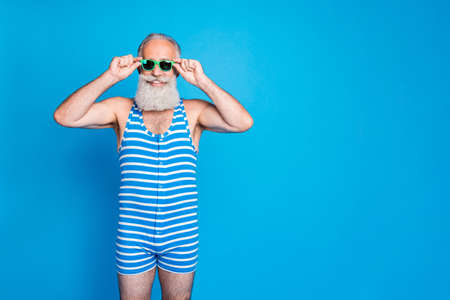 Portrait of his he nice attractive content cheerful cheery gray-haired man spending spring life...