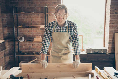 Portrait of his he nice attractive handsome blond cheerful cheery guy builder creating new project start-up shop at industrial brick loft style interior workplaceの写真素材