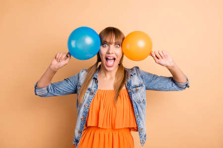Portrait of lovely teen millennial scream shout crazy she her good-looking dressed orange skirt...