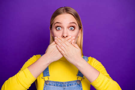 Close up photo of anxious girl hide her face wear yellow turtleneck denim jeans overall isolated...