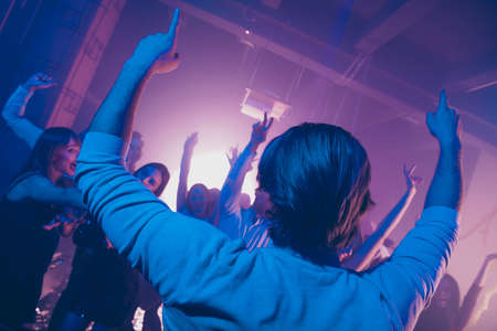 Welcome to the best cool careless carefree party occasion celebration. Group of glad positive guys cheering hanging out in modern place indoorsの写真素材