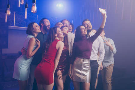 Portrait of nice-looking attractive shine pretty stylish adorable cheerful cheery positive glad ladies and guys having fun rest relax taking making selfie at luxury fogged nightclub indoorsの写真素材