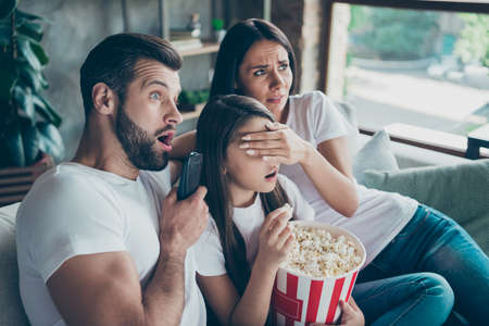Portrait of nice attractive lovely charming family mommy daddy wearing casual white t-shirts jeans...