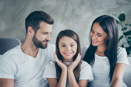 Close-up portrait of nice attractive lovely winsome cute charming cheerful cheery idyllic family enjoying spending leisure free time holiday indoorsの写真素材