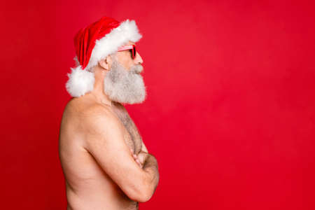 Close-up profile side view portrait of his he nice attractive handsome, funky content peaceful calm gray-haired man folded arms isolated over bright vivid shine red backgroundの写真素材