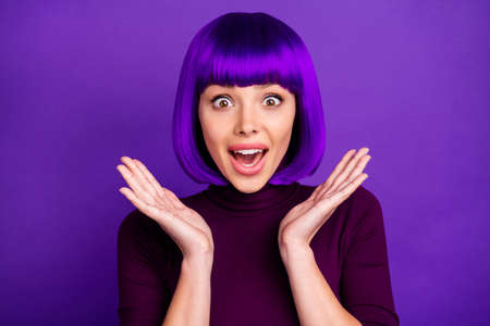 Close up photo of impressed youth yelling unbelievable wearing turtleneck isolated over purple violet backgroundの写真素材