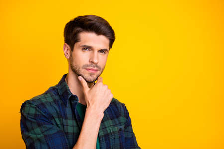 Closeup photo of amazing macho guy thinking about important business decision wear casual plaid shirt isolated yellow color backgroundの写真素材