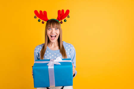 Giftbox from secret Santa concept. Photo of cheerful screaming celebrating optimistic with...