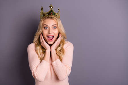 I wish world piece. Photo of funny lady with golden crown on head overjoyed by nomination wear casual trendy pullover isolated grey color backgroundの写真素材