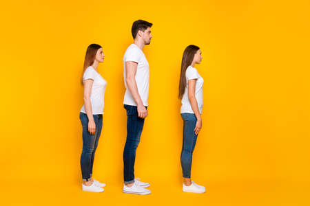 Full length profile side photo of focused youth looking wearing white t-shirt denim jeans isolated...