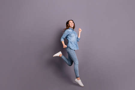 Full body profile photo of pretty lady jumping high running shopping, center to catch low prices...