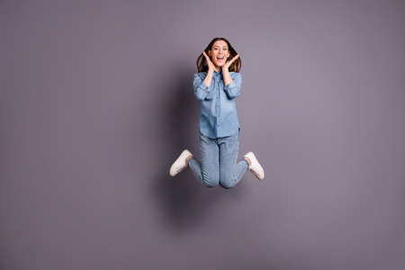 Full body photo of pretty lady jumping high celebrating great win of football, team wear casual...