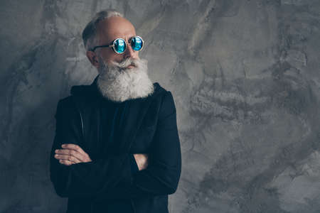 Profile side photo of attractive harsh masculine pensioner look crossing his hands wearing coat raincoat isolated over gray backgroundの写真素材