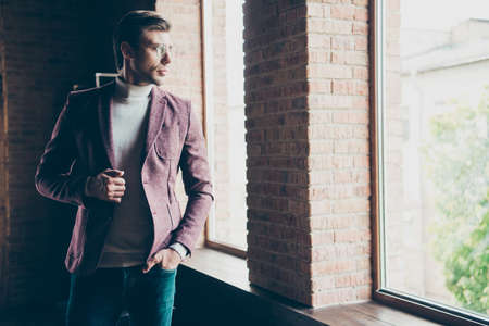 Photo of classy macho business guy looking window dreamy thinking about new startup, wear specs...