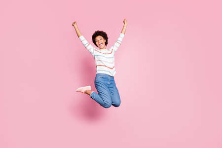 Full length body size photo of cheerful cute charming positive sweet pretty black millennial jumping...