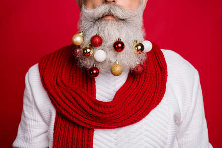 Cropped photo of serious retired person having glass balls on his beard wearing white sweater...
