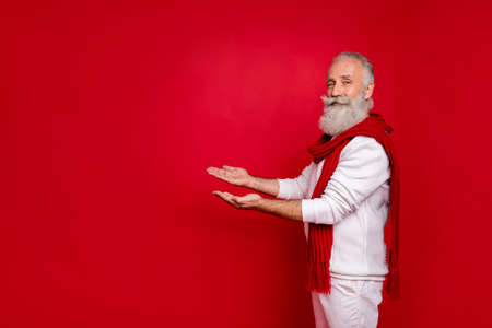 Profile side photo of cool elderly pensioner carrying copyspace wearing white sweater pants trousers...