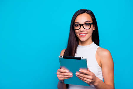 Photo of pretty youngster lady holding e-book in hands ready to listen lecture and make notes wear...