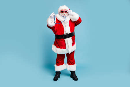 Full length body size view of his he nice funky bearded Santa Claus wearing phonendoscope making diagnostic isolated over blue turquoise pastel color backgroundの写真素材