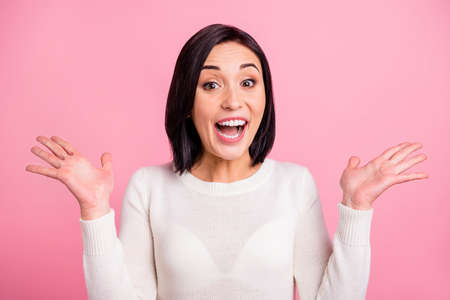 Photo of funny business lady raising arms air celebrating startup success wear white pullover isolated pink color backgroundの写真素材