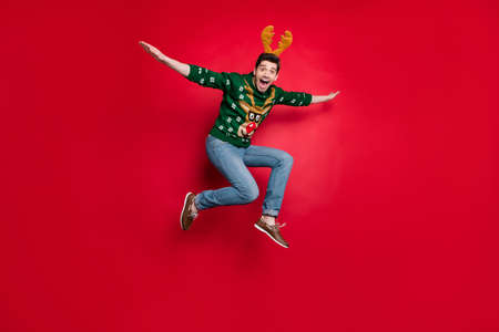 Full length photo of funny jumping guy spread arms flying fast to sale x-mas shopping wear pullover...