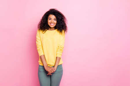 Portrait of sweet mulatto youth positive girl enjoy weekends have fun with her new friends wear good look sweater pants isolated over pastel color backgroundの写真素材